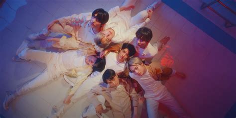 ENHYPEN move through different worlds in 'FEVER' music video .